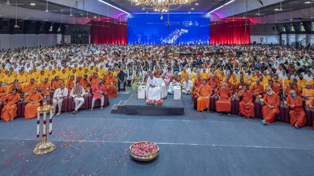 Amma sits with the entire ashram for the inaguration