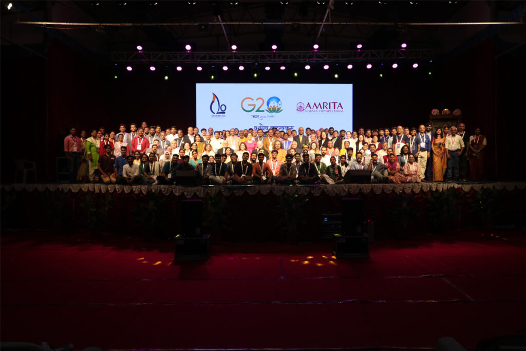 The G20/C20 banner looms large and bright with all the speakers of the summit on stage.