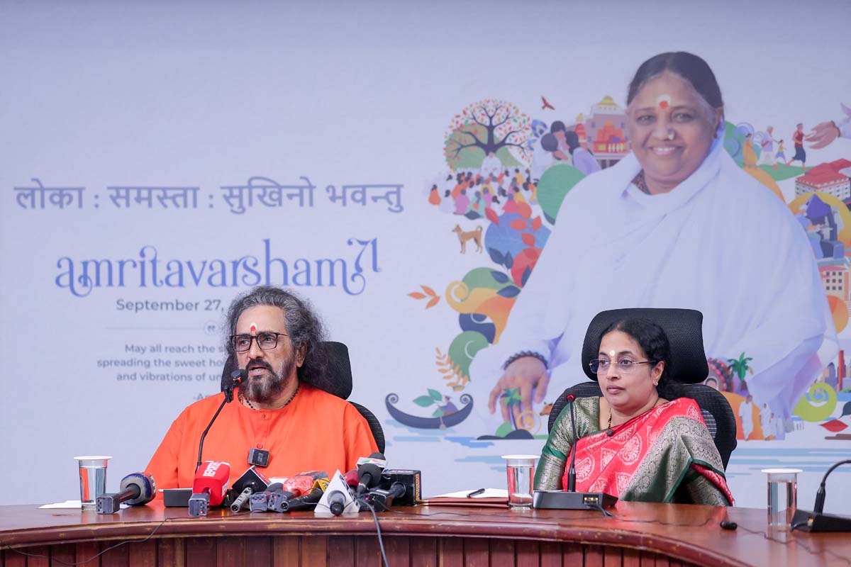 A swami and a scientist at a press conference