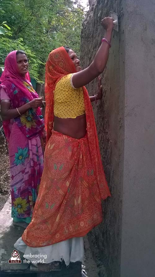 Indian village women lay cement