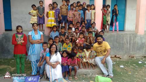 Village children with volunteers