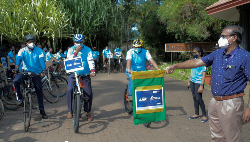 Students cycle with banners