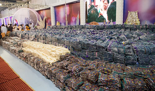 150,000 saris stacked on stage