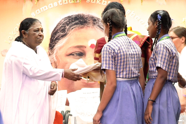 Amma distributes saukyam pads to young girls