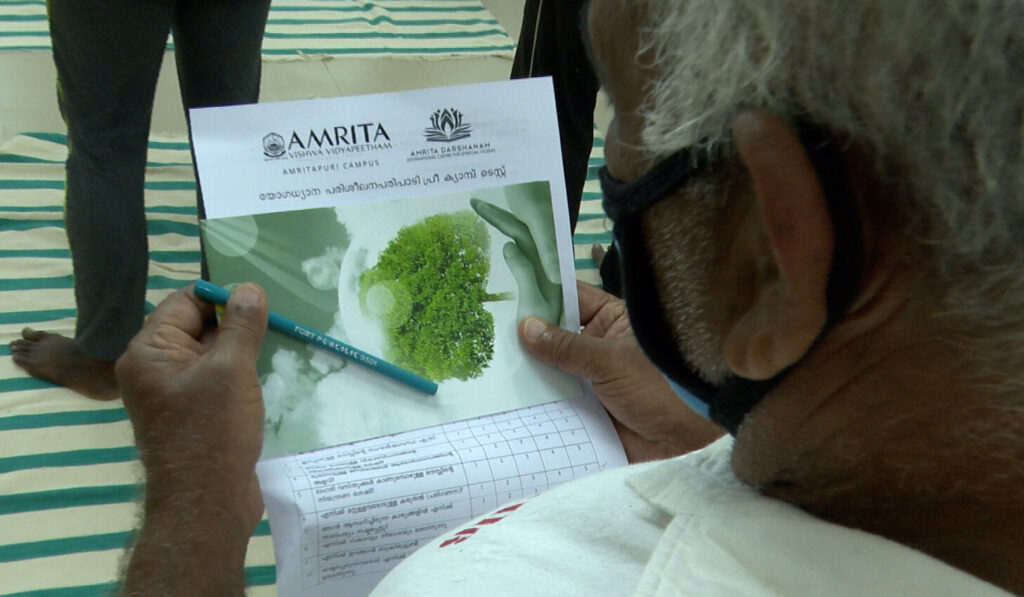 Prison inmate reads a health screening document.