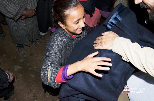 Young girl receives blanket