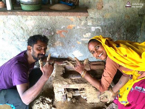 man and woman build a stove together