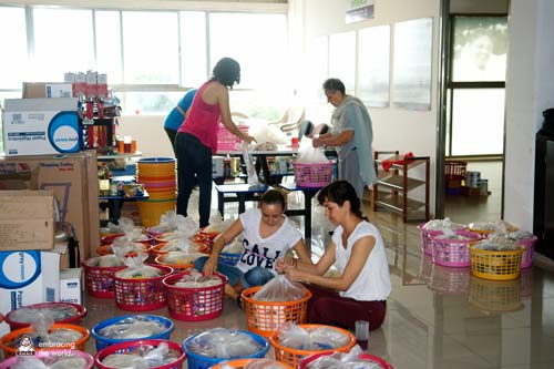 Volunteers sort supplies