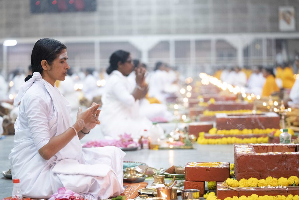 Female monastics pray