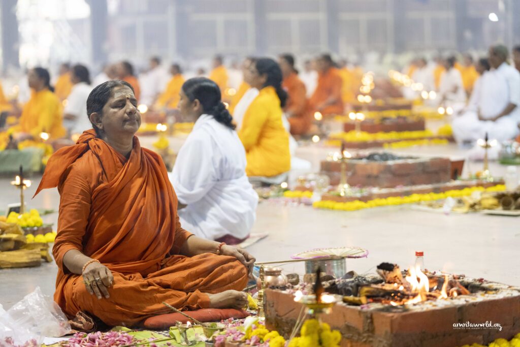 Female priests sit in meditation