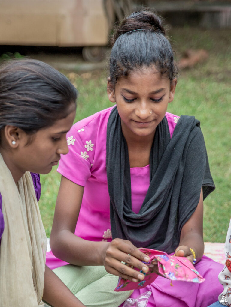 Young women look at Saukyam pads