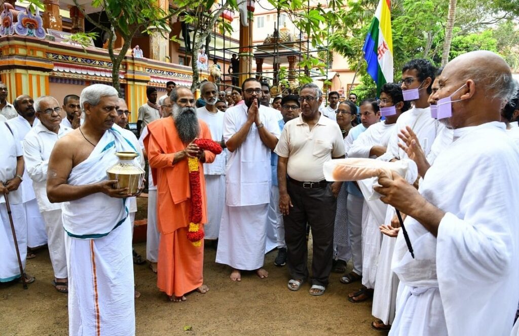 members of the group standing in front of the main building of the Ashram.