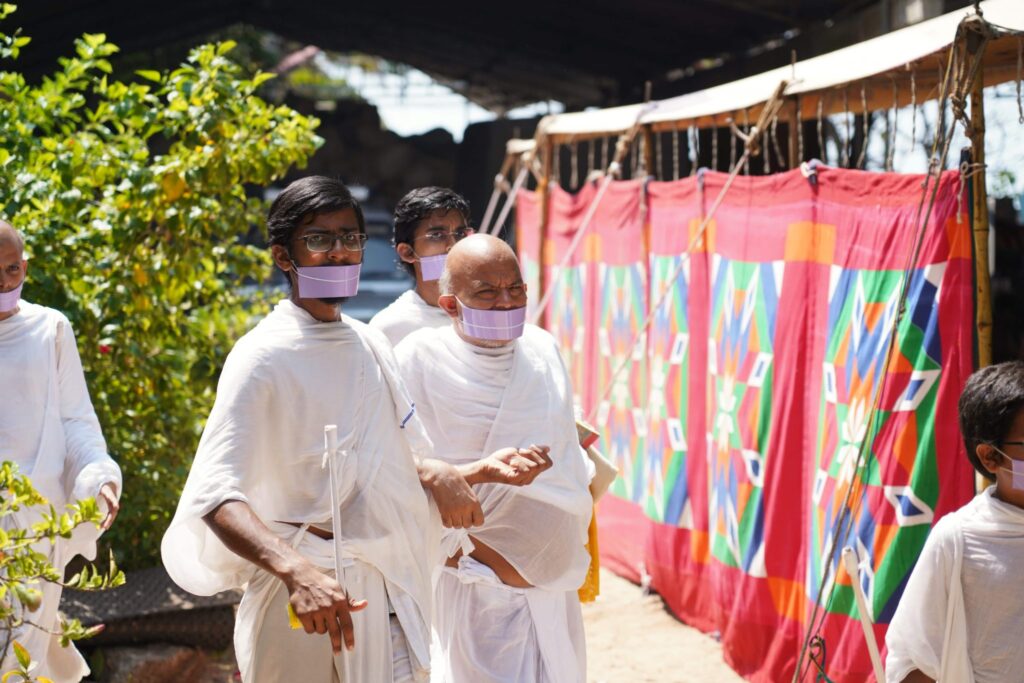 H.H. Acharya walking in the ashram grounds.