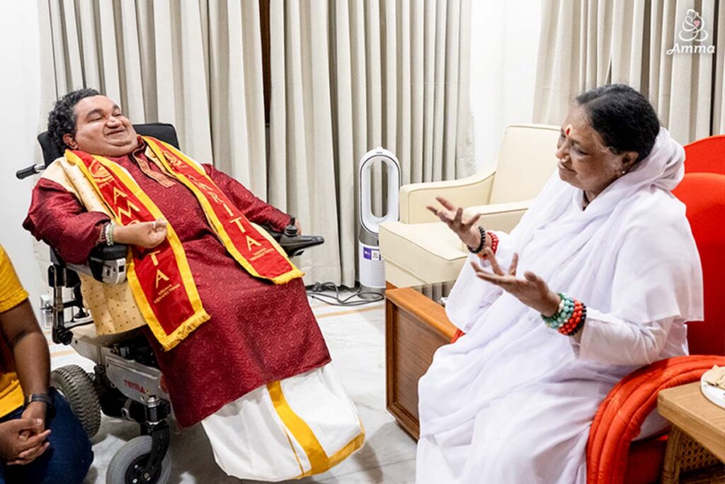 Amma and a special guest speak