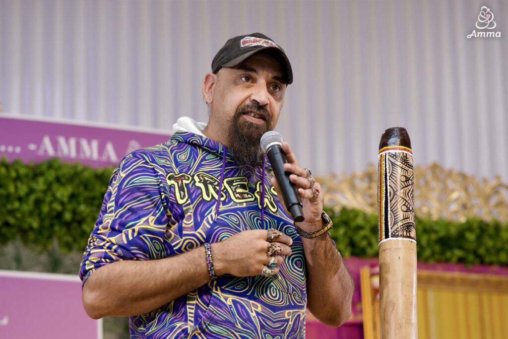A man speaks at a microphone