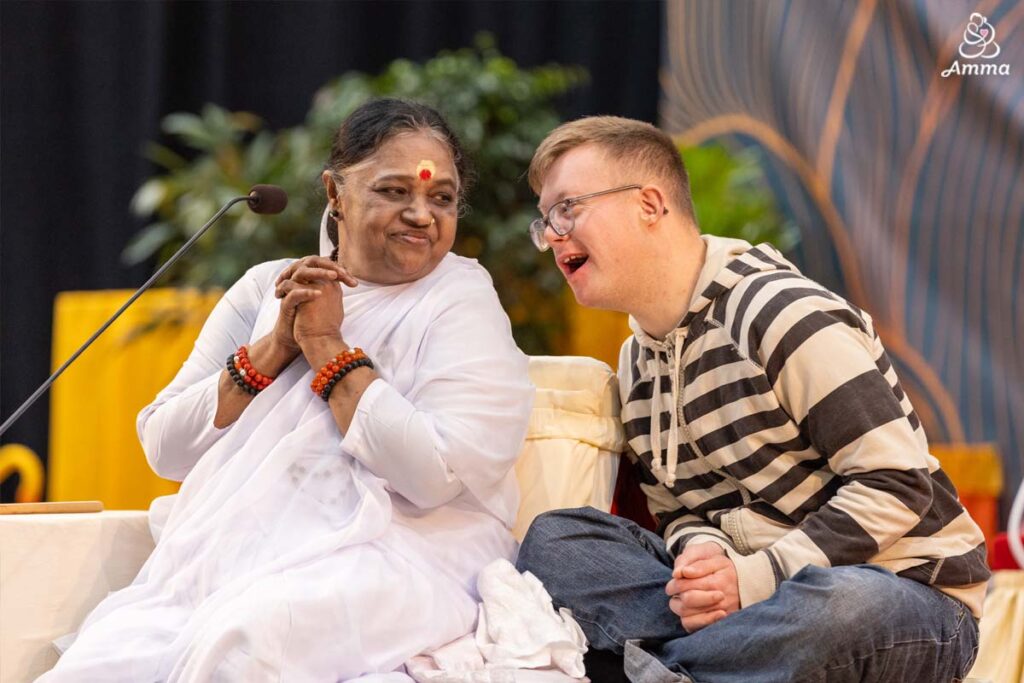 Amma with a teenage boy with downs syndrome