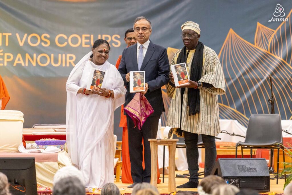 Amma with two dignitaries