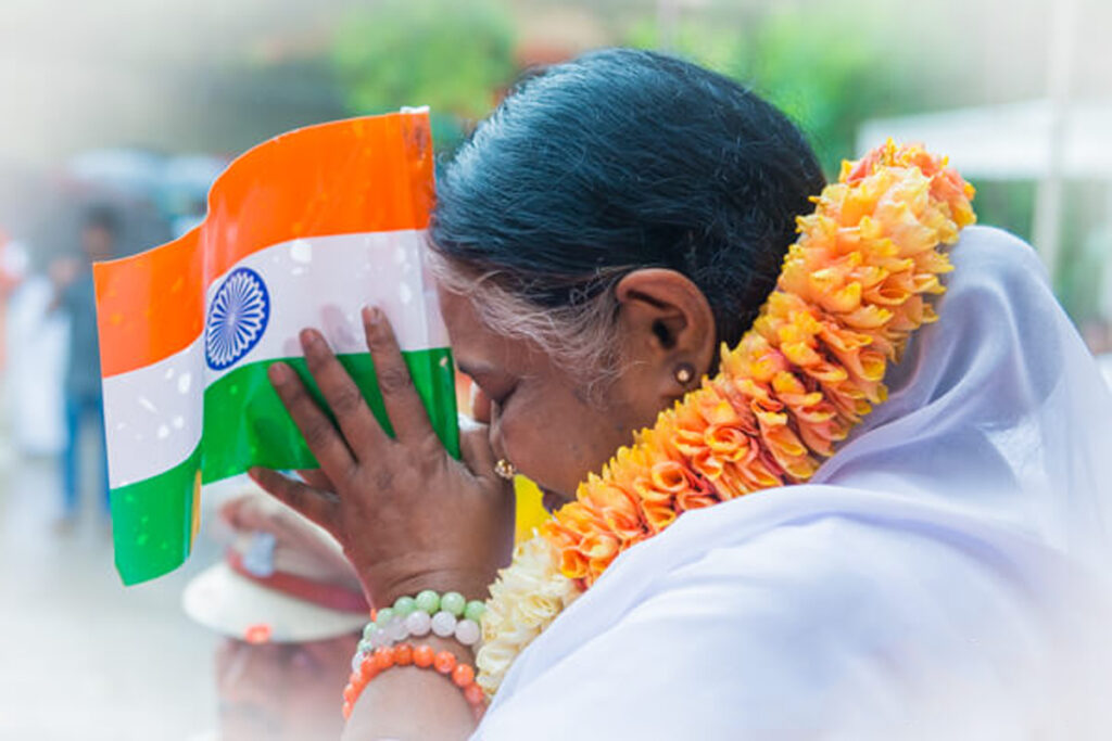 Amma blessing a small flag of India