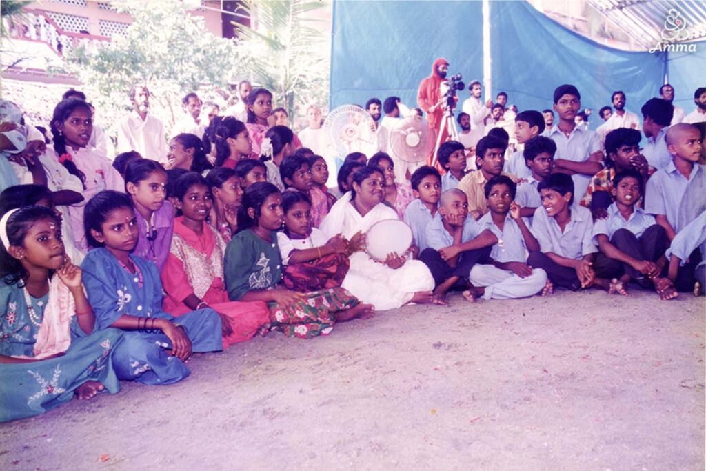 Amma with a group of children
