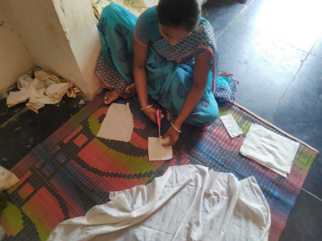 Woman making masks by hand