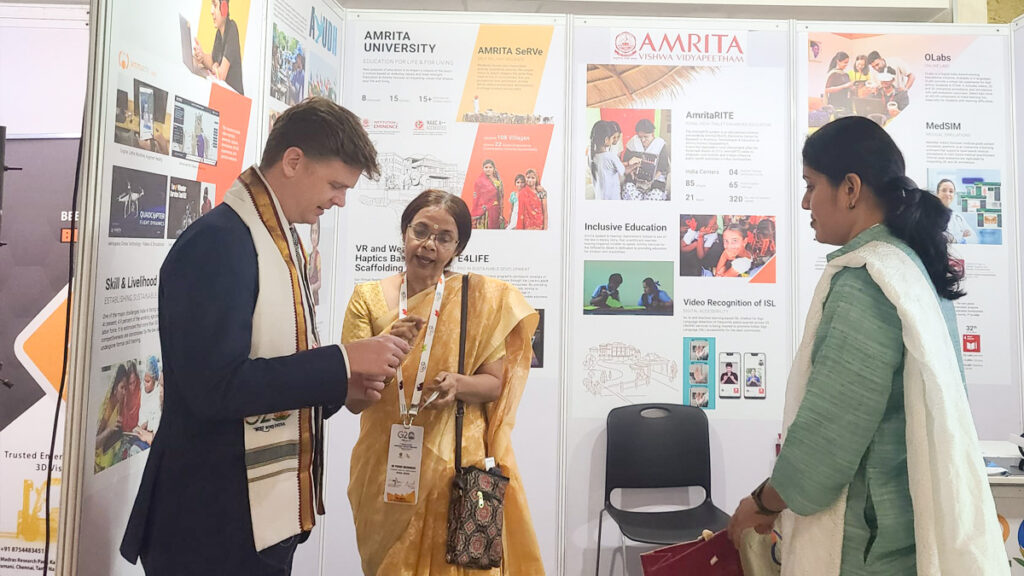 Dr. Prema Nedungadi talks with Mr. Mathew Johnston