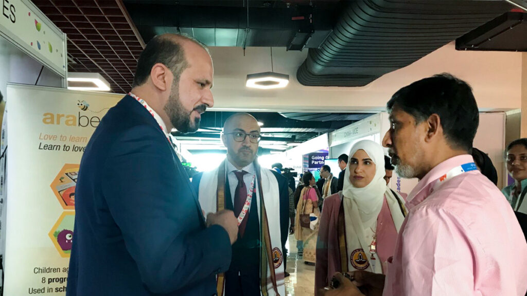 Prof. Raghu speaks with international delegates.