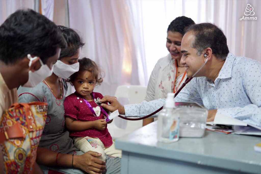 a doctor measures a child's heartbeat