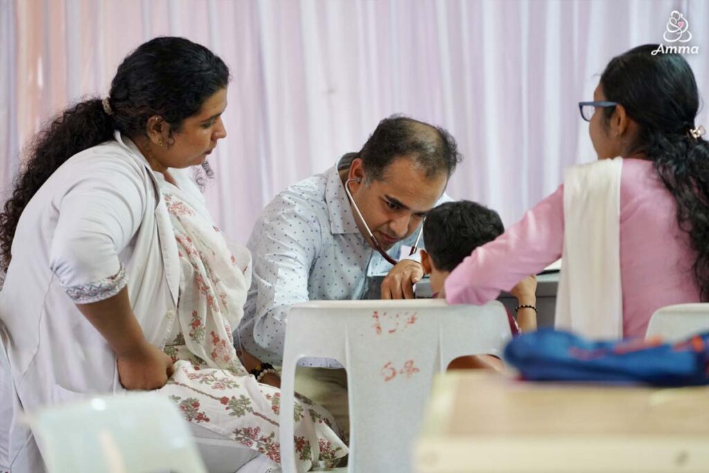 a doctor takes a child's heartbeat