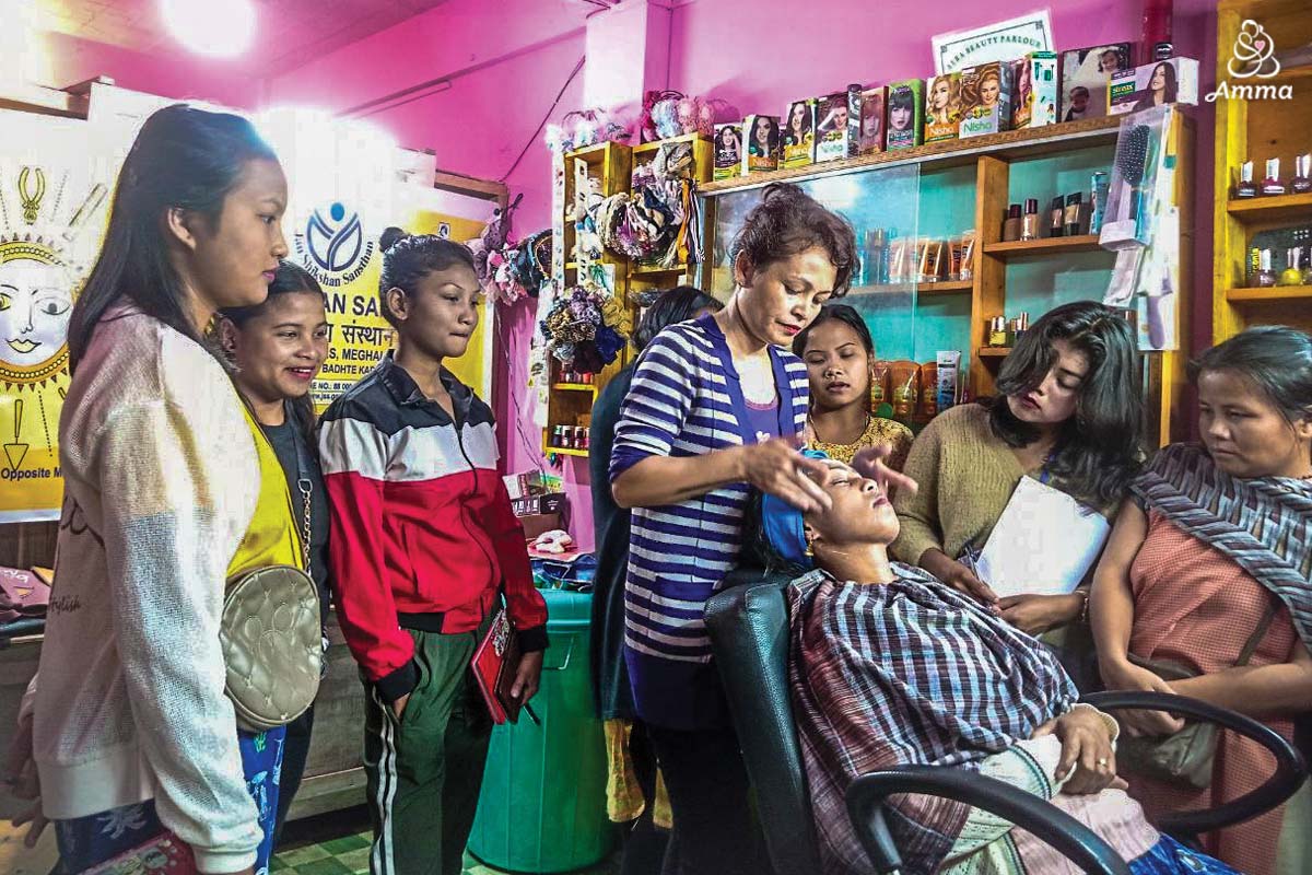 a beautician treats a client with trainees around her