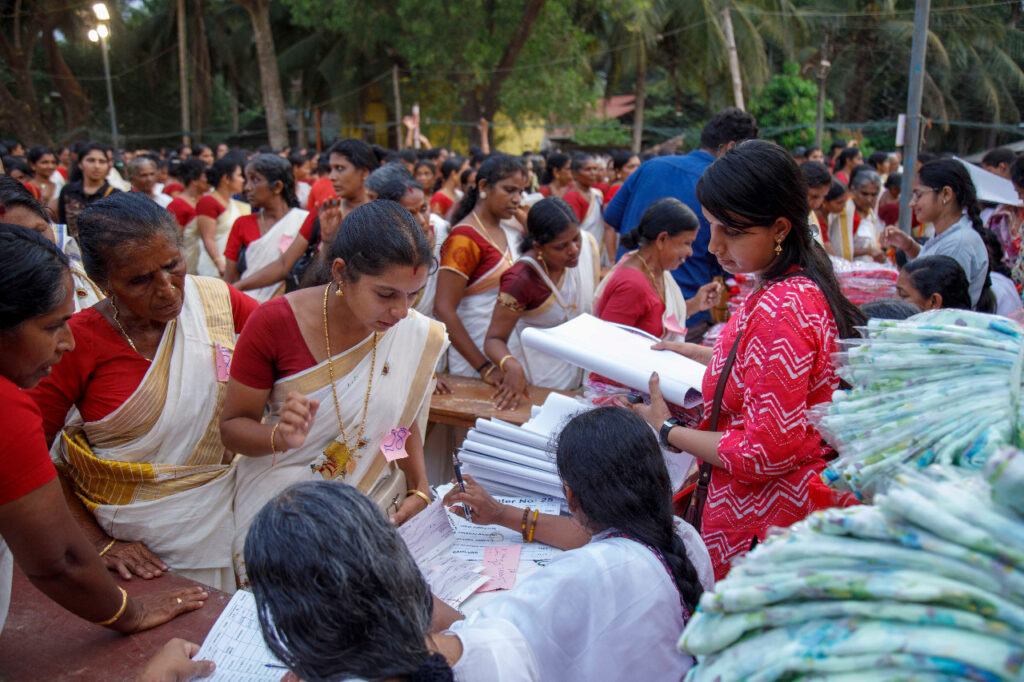 Women distribute free saris