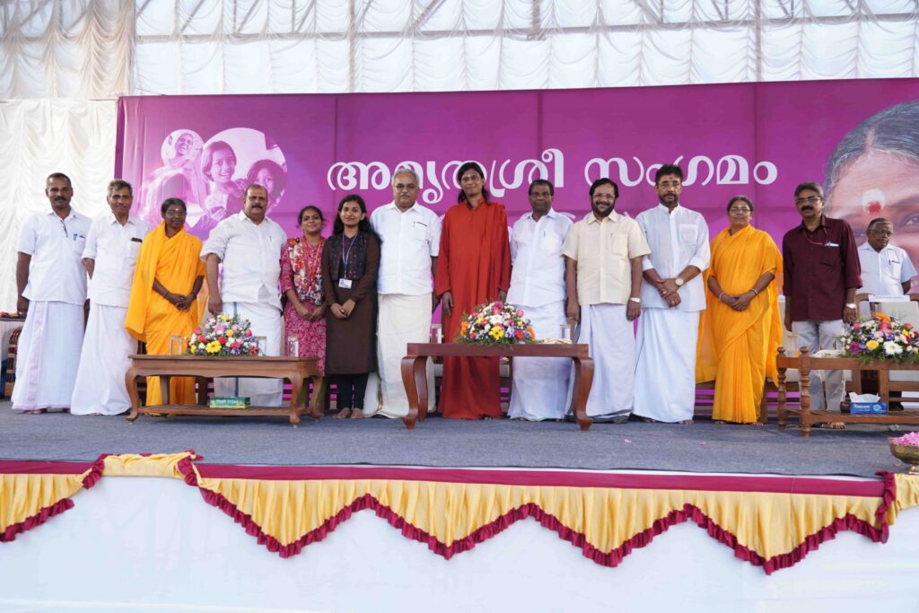 Dignitaries stand together on stage