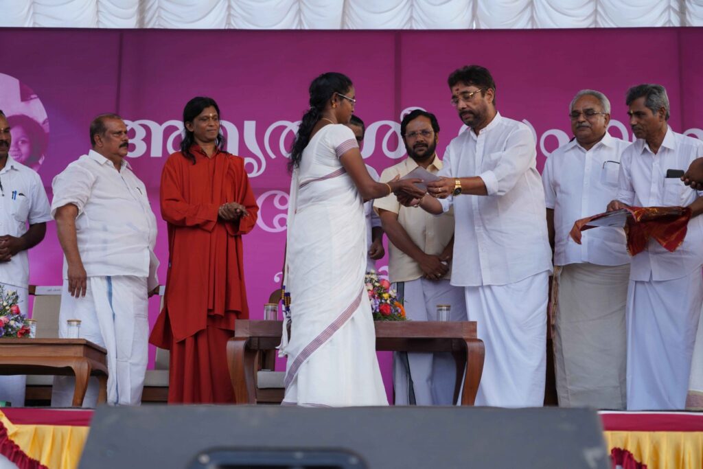 Woman receives aid from dignitary