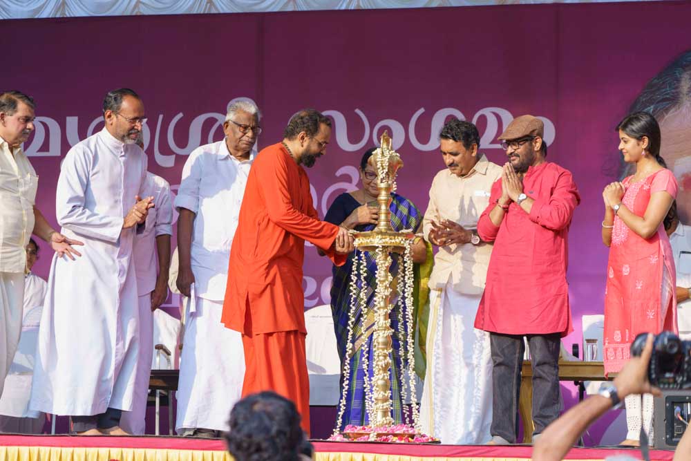 Swami lights lamp