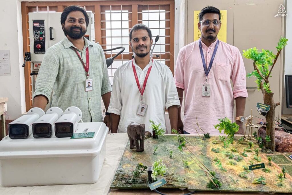 three men with elephant monitoring equipment