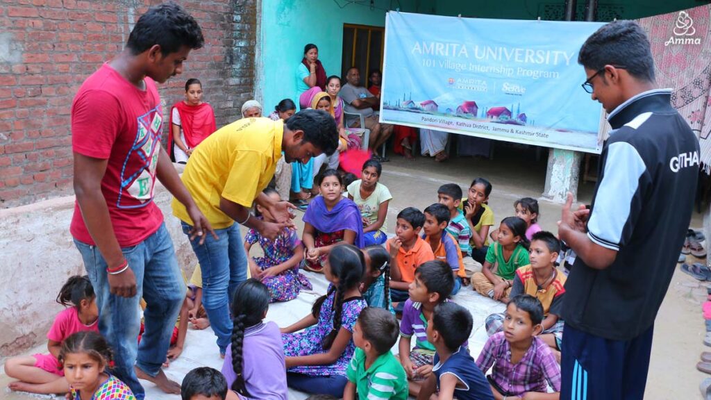 PhD students with children in a village school