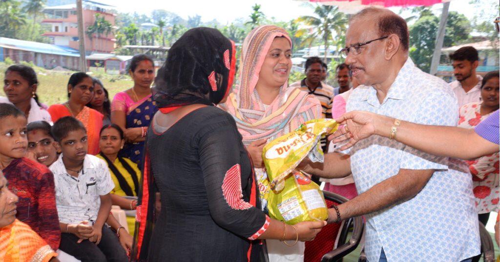 Mariam Bibi distributes basic supplies to people in Bambooflat.