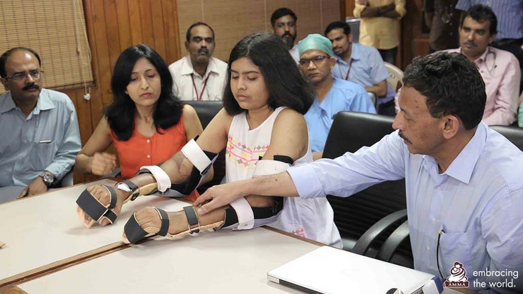 A hand transplant patient with family and doctors