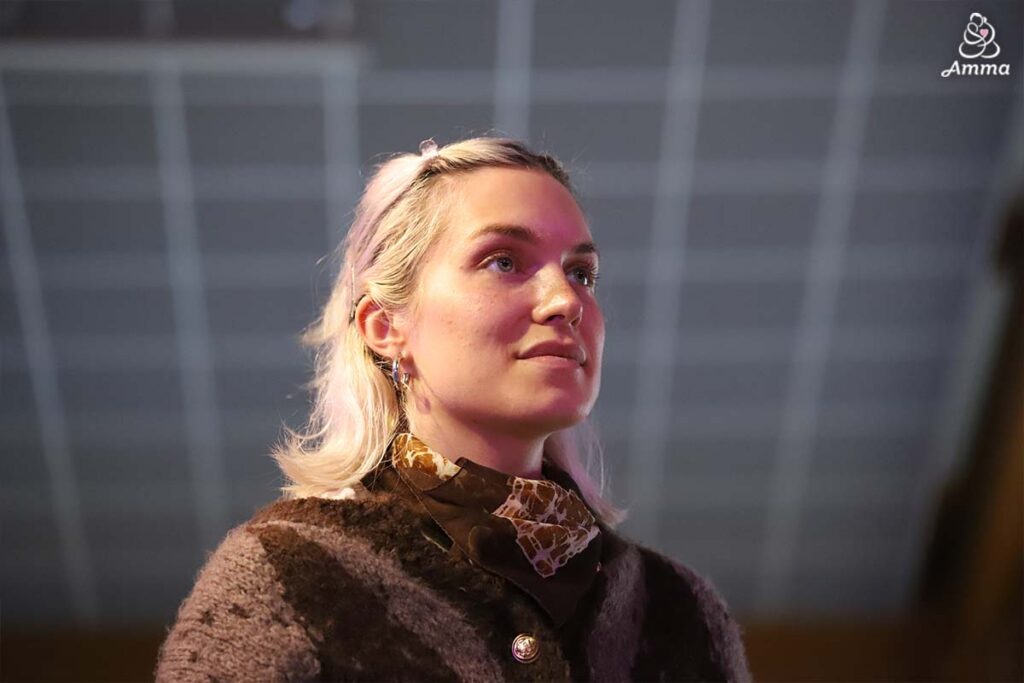 a young woman looks forward
