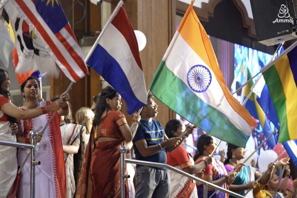 young people hold various country flags