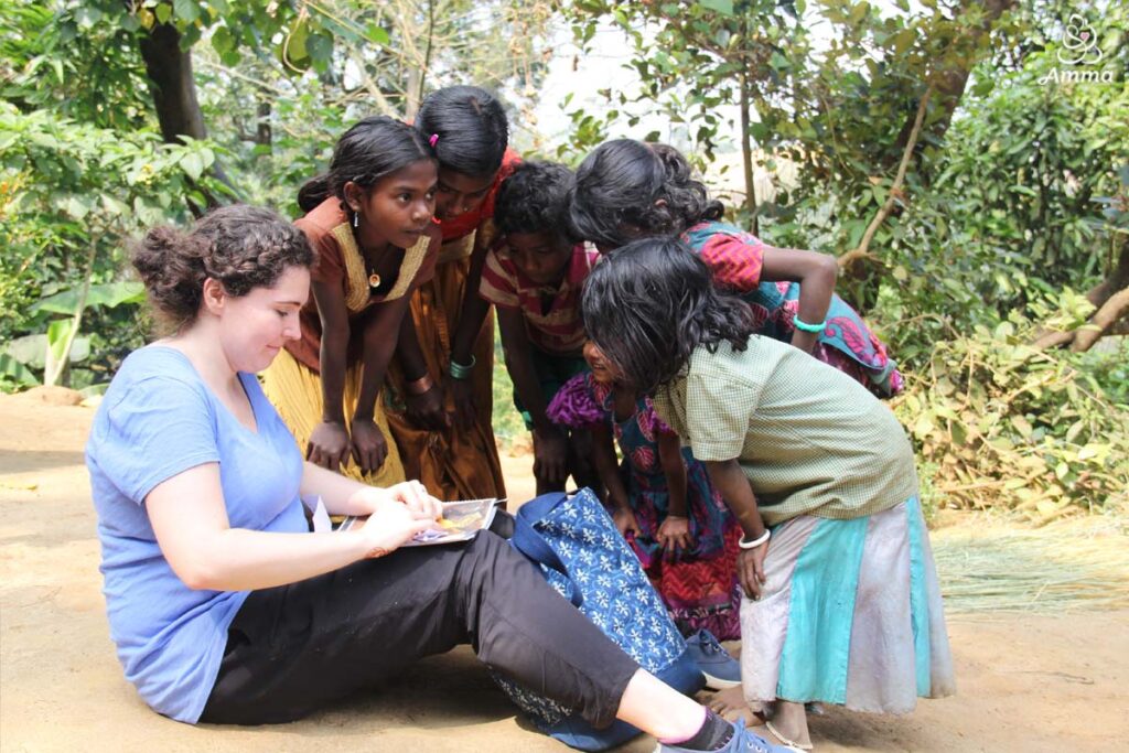 A young woman with girls in a village