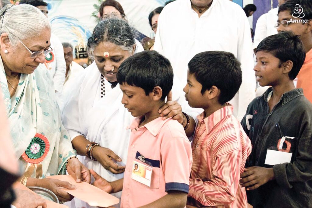 Amma giving scholarships to children