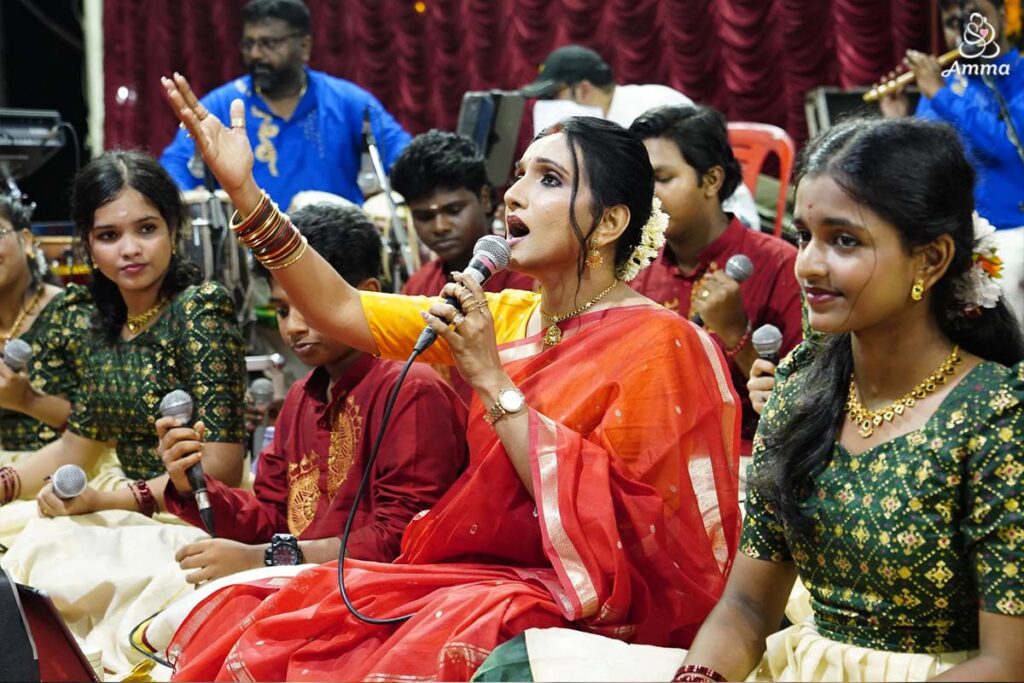 A musical group performs, with the singer at centre