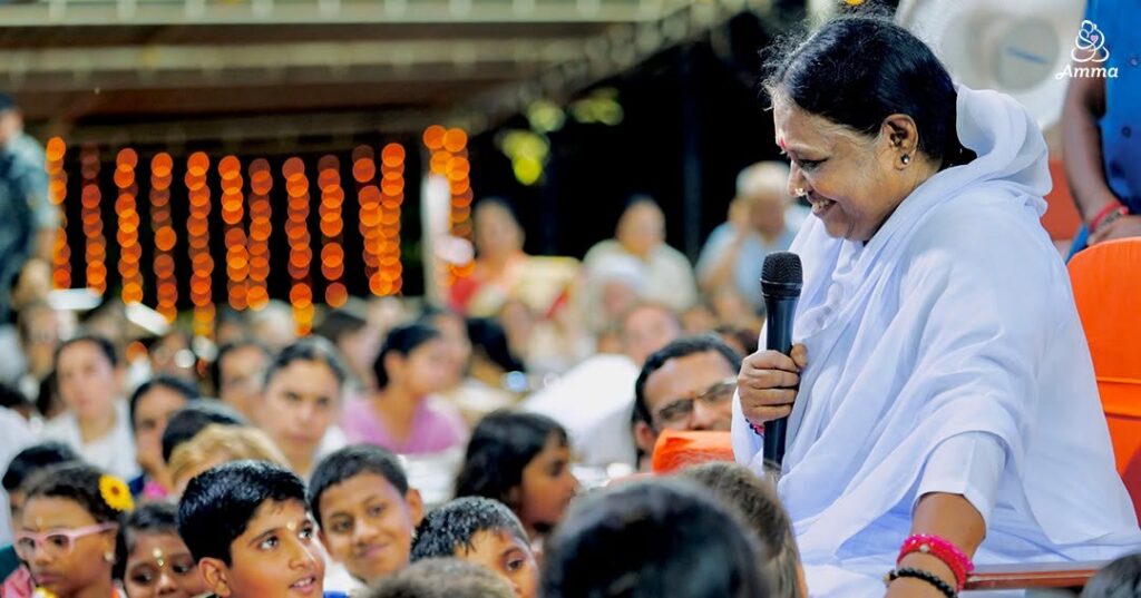 Amma laughing with her children