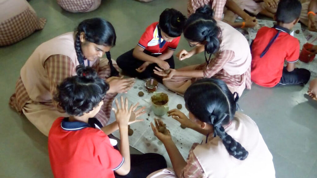 Amrita Vidyalayam girls teach other girls to make seed balls