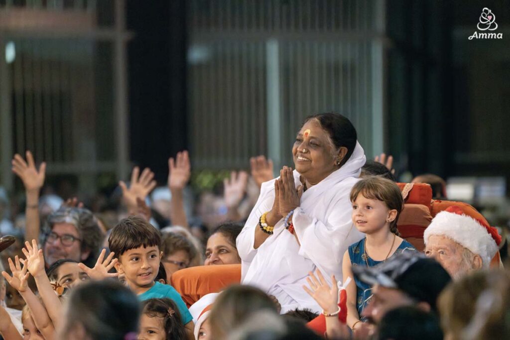 Amma with children on Christmas Eve