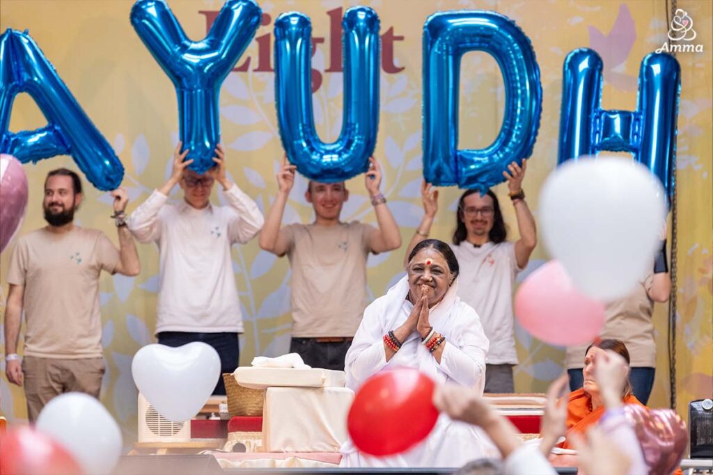 Amma with youth behind her