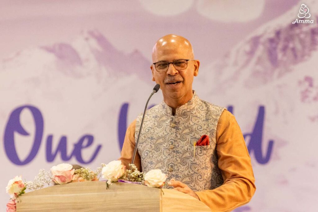 a man speaks at a microphone