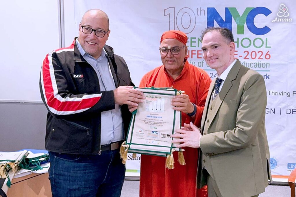 three men hold a banner for an award