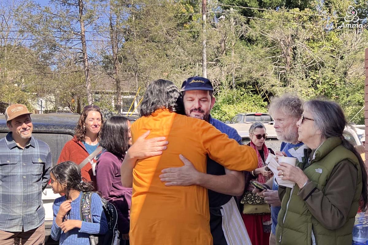 a brahmachari embraces a man