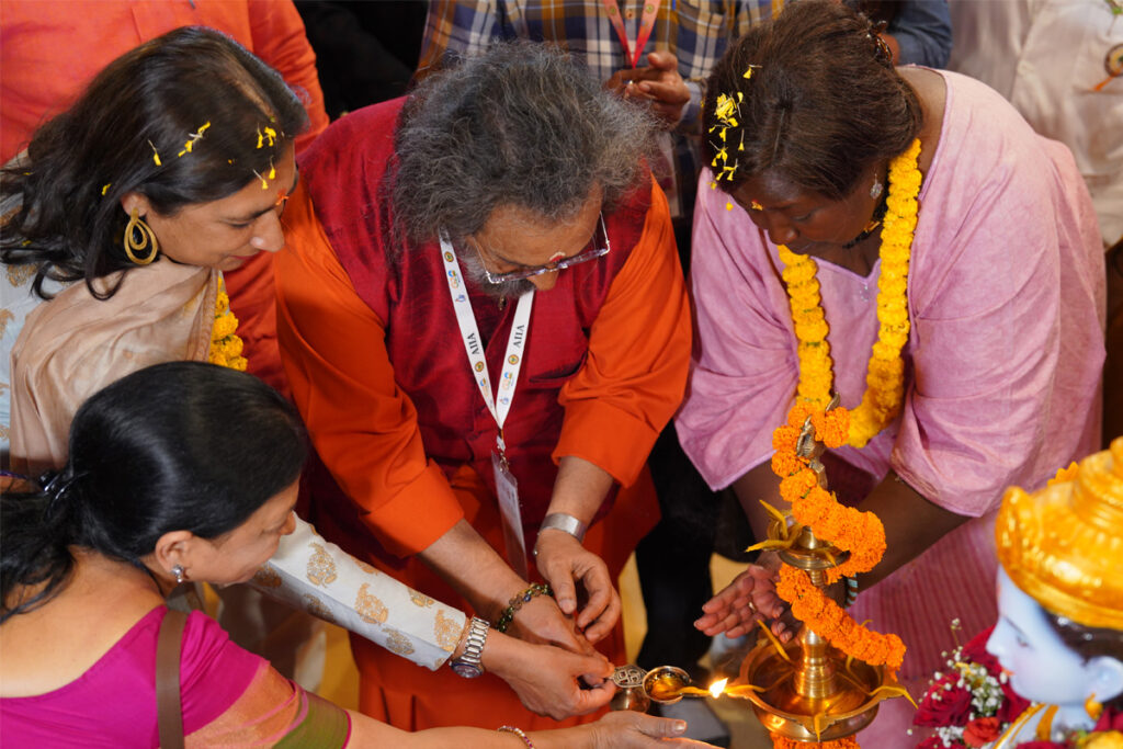 Summit speakers lighting the lamp at the beginning of the Summit.